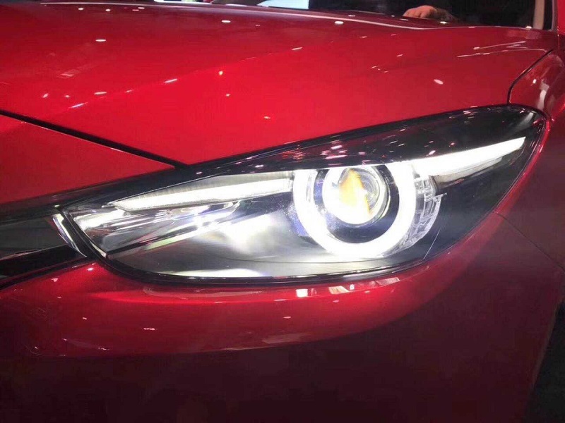 Độ xe Mazda 2 den pha mazda 3 ban 2.0